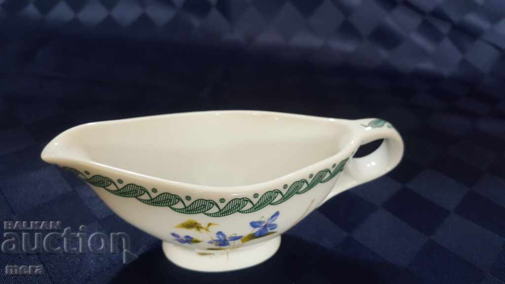 A small porcelain saucer with price 12.00 BGN | € 6.14 A small porcelain saucer with price 12.00 BGN | € 6.14