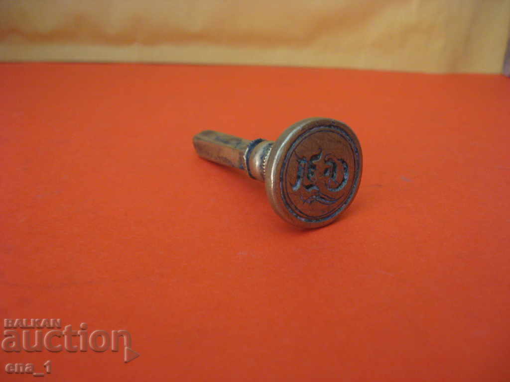 Delivery of Old bronze Western European stamp with Gothic letters Delivery of Old bronze Western European stamp with Gothic letters