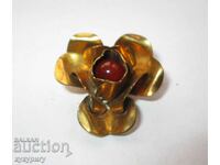 Old lady's gold plated flower brooch