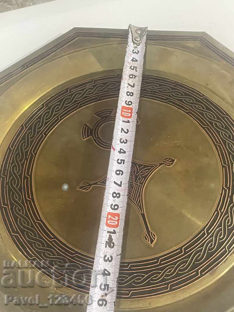 Delivery of metal wall plate with strange symbolism