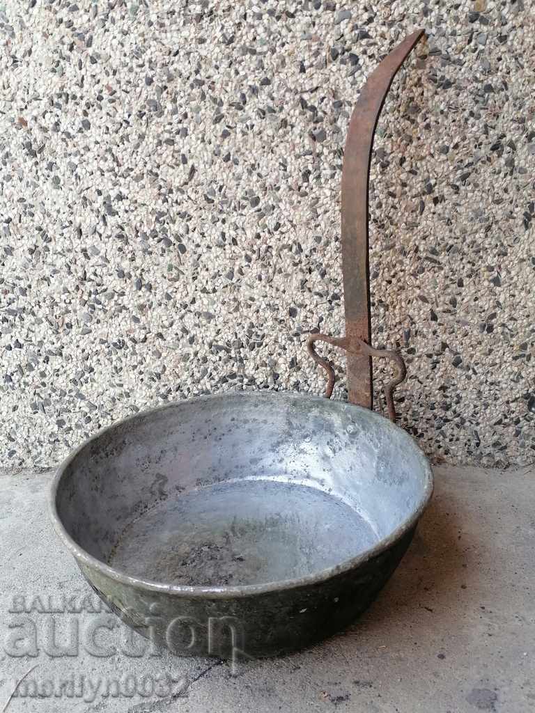 An old copper pan, a baker, a tray, a copper pot, a household pot