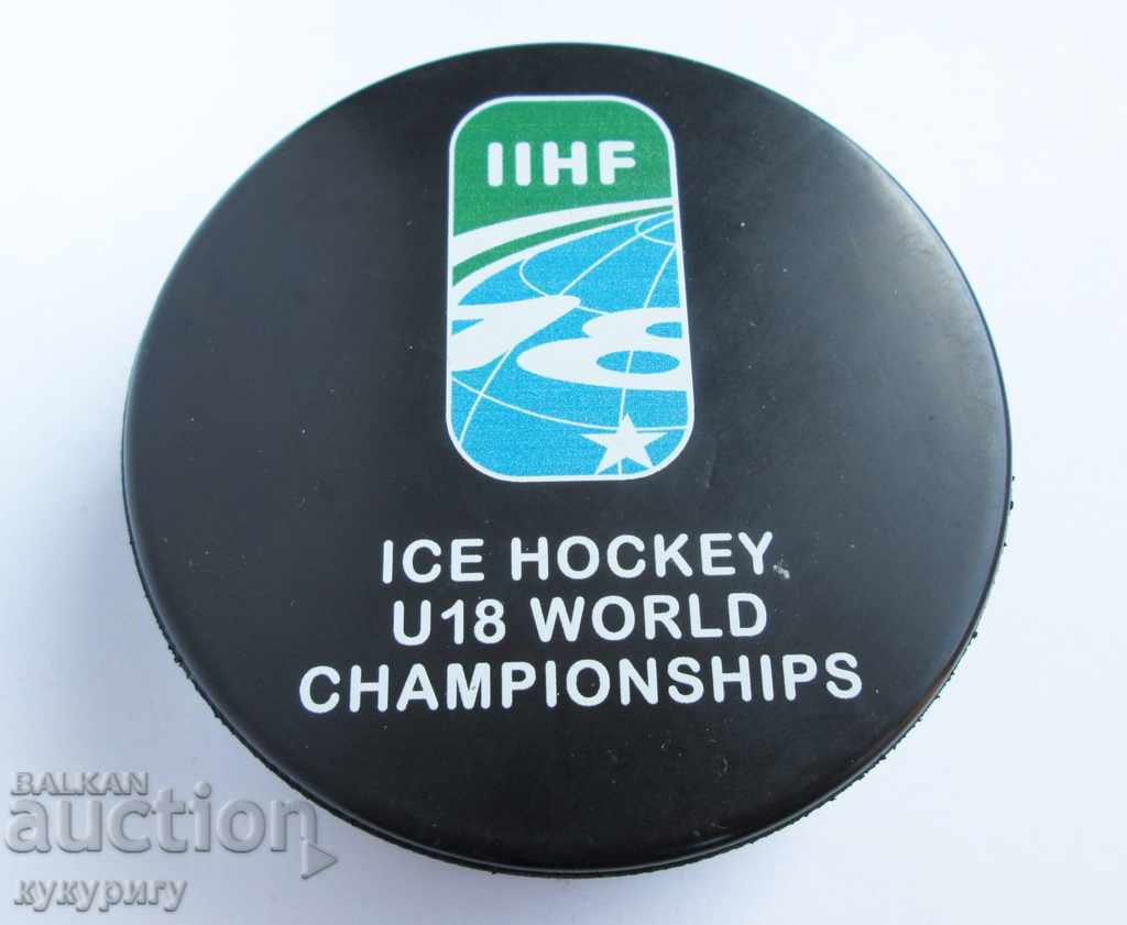 Old prize puck from the World Ice Hockey Championship