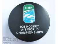 Old prize puck from the World Ice Hockey Championship