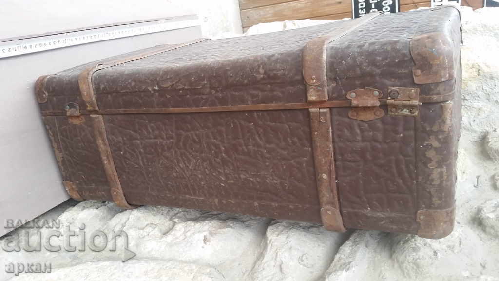 Delivery of Old massive suitcase Delivery of Old massive suitcase