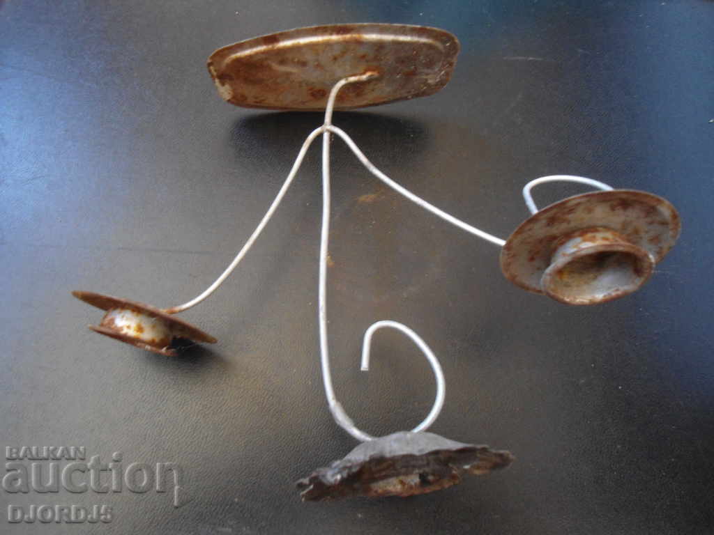 An old metal candleholder with price 2.00 BGN | € 1.02