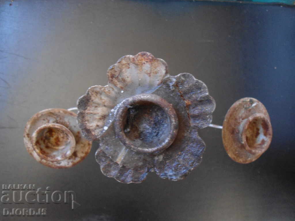 Auction  An old metal candleholder