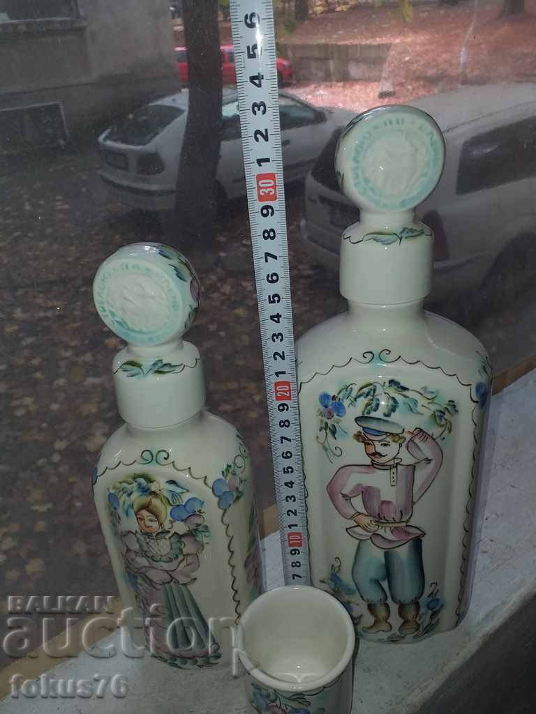 Delivery of Russian porcelain two bottles and a cup with Cossack motifs Delivery of Russian porcelain two bottles and a cup with Cossack motifs