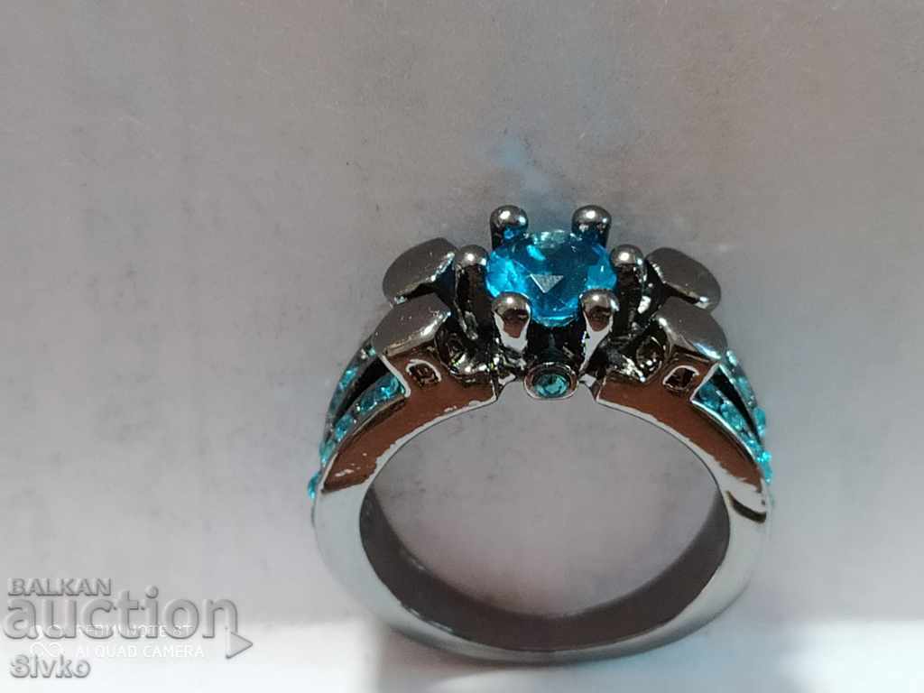 Auction  Silver-plated ring with topazes