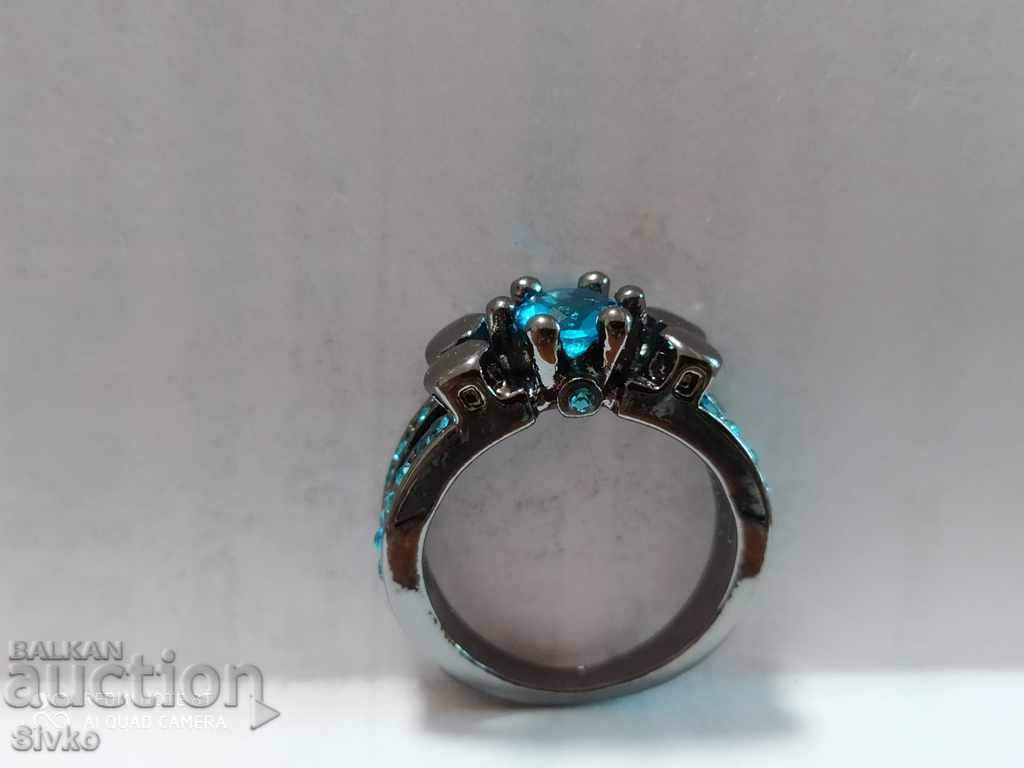 Silver-plated ring with topazes