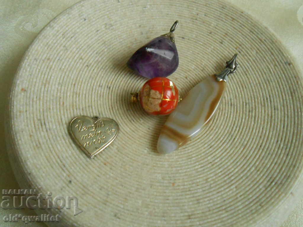 Auction Interesting pendants, medallions, silver and natural stones Auction Interesting pendants, medallions, silver and natural stones