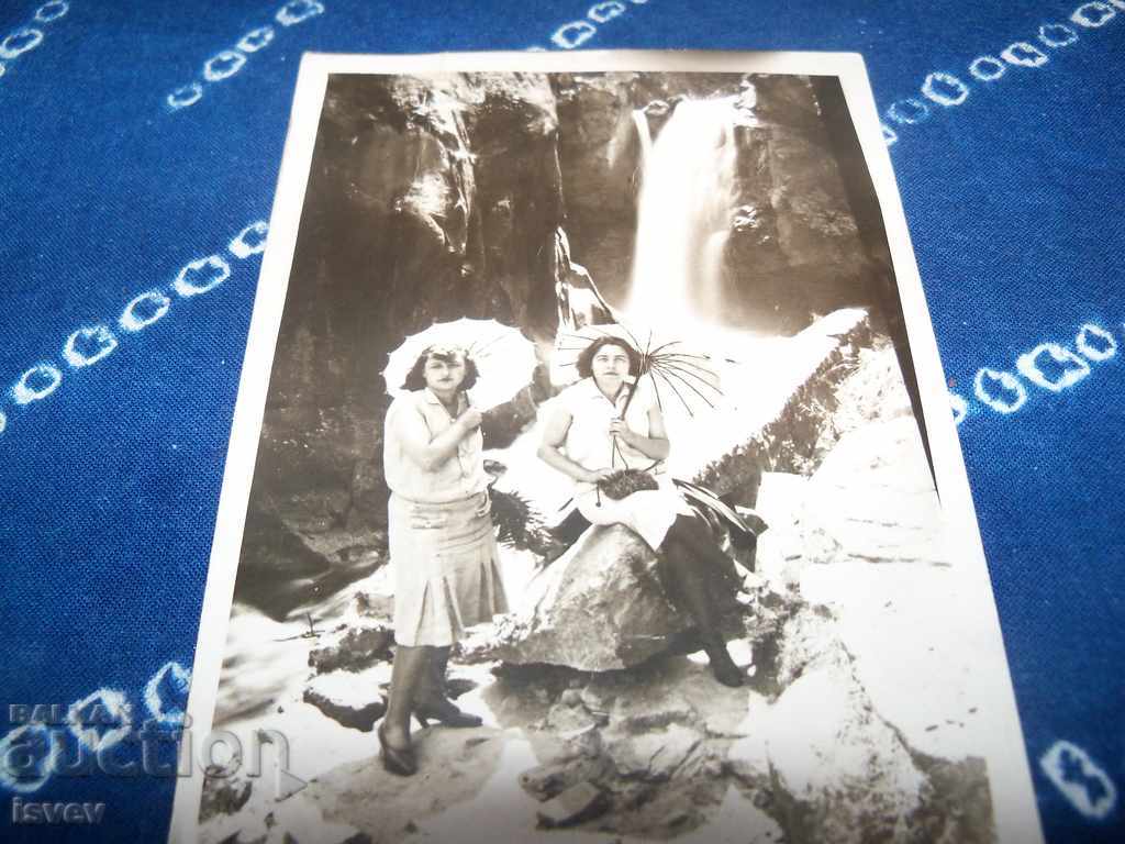 Delivery of Old postcard photo, women with umbrellas, no captions. Delivery of Old postcard photo, women with umbrellas, no captions.
