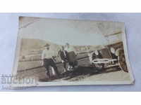 S-ka Thermopolis Two men and a woman in front of a retro car 1924