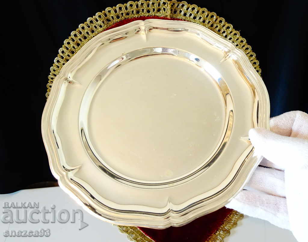 Silver-plated brass plate.