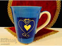 Cup of cobalt, gold, hand-painted Cha Cult.
