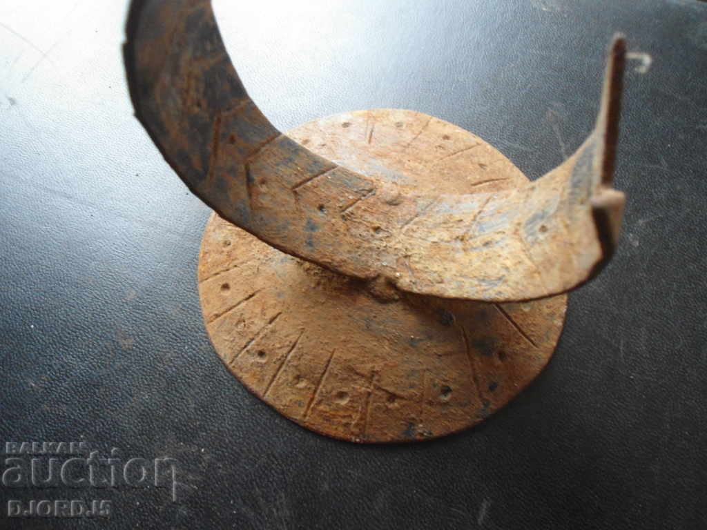 Delivery of An old forged candlestick