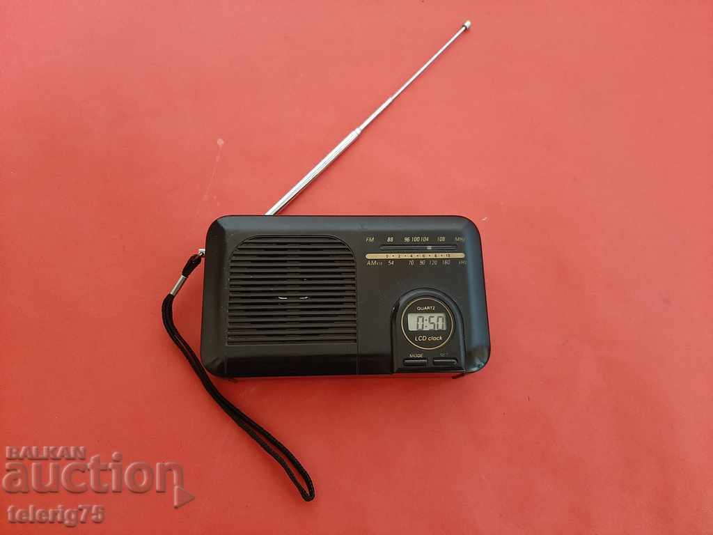 Radio cu ceas FM/VHF