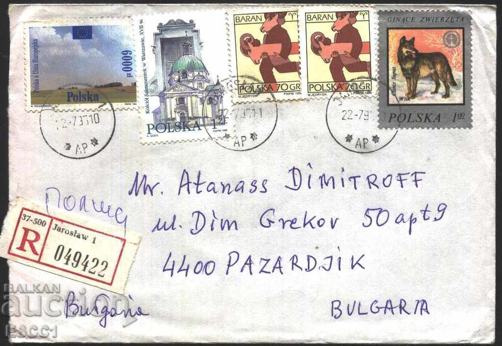 Traveled envelope with stamps Church 1996 Zodiac 1996 Wolf from Poland