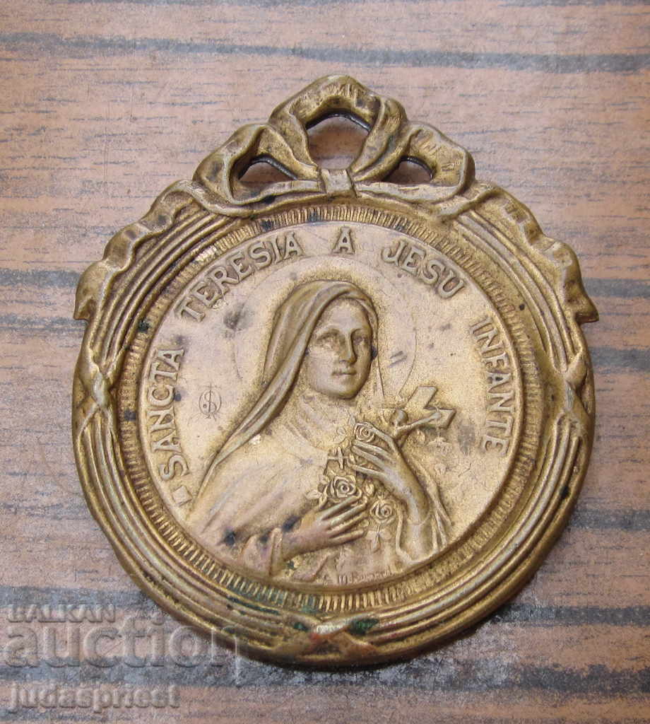 an old antique small home bronze icon of St. Teresa