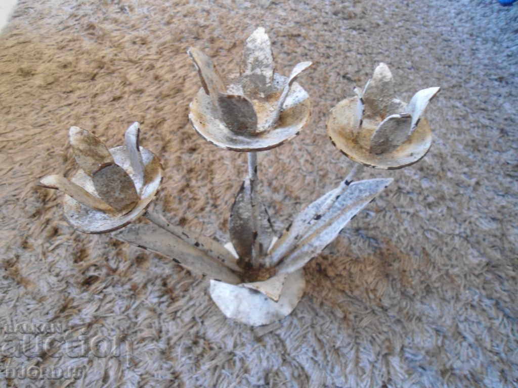 Auction  An old forged candlestick