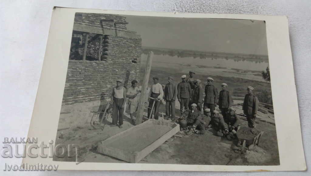 Ms. Officer and soldiers at a newly constructed outpost building