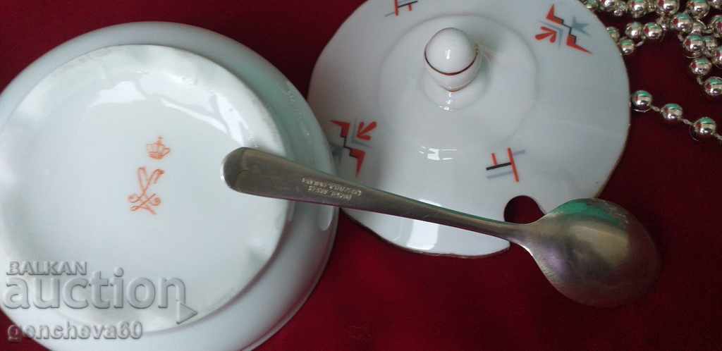Fine porcelain sugar bowl and silver spoon