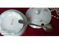 Fine porcelain sugar bowl and silver spoon