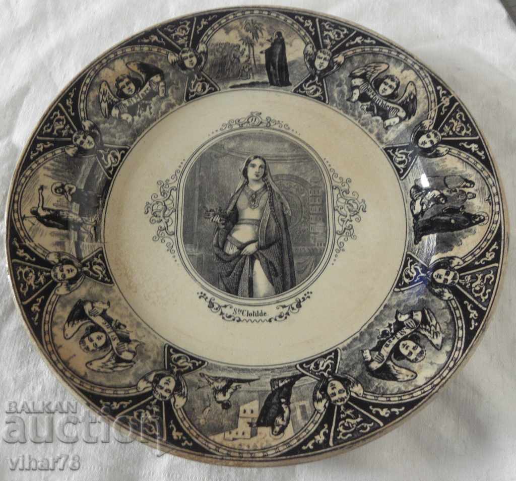 old plate with ecclesiastical motifs