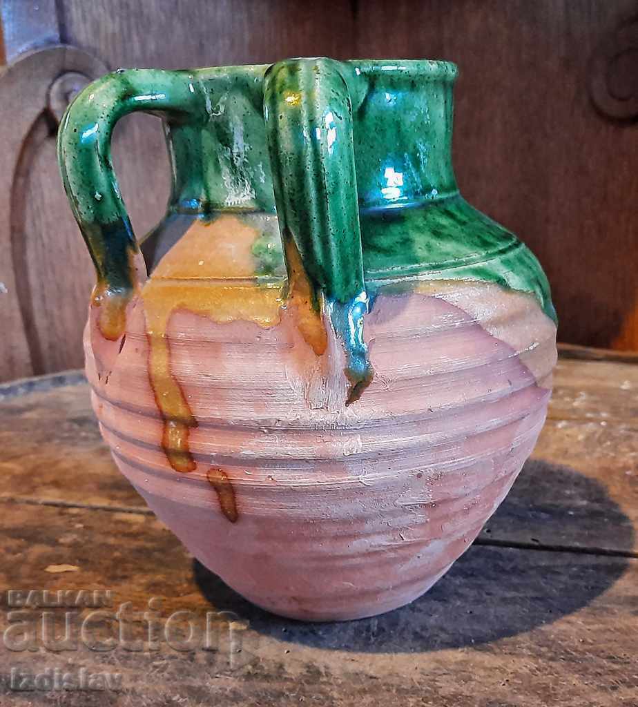 Auction  Old glazed pot with interesting handles