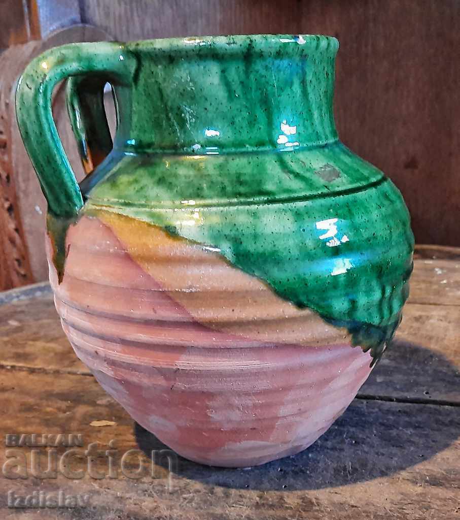 Delivery of Old glazed pot with interesting handles