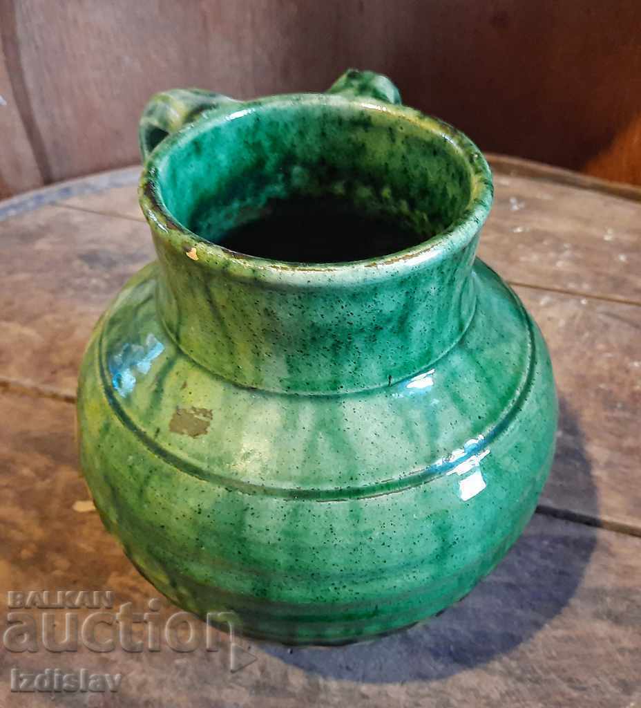 Old glazed pot with interesting handles