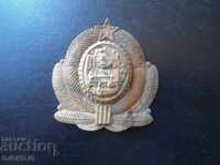 Old metal badge from the sauce