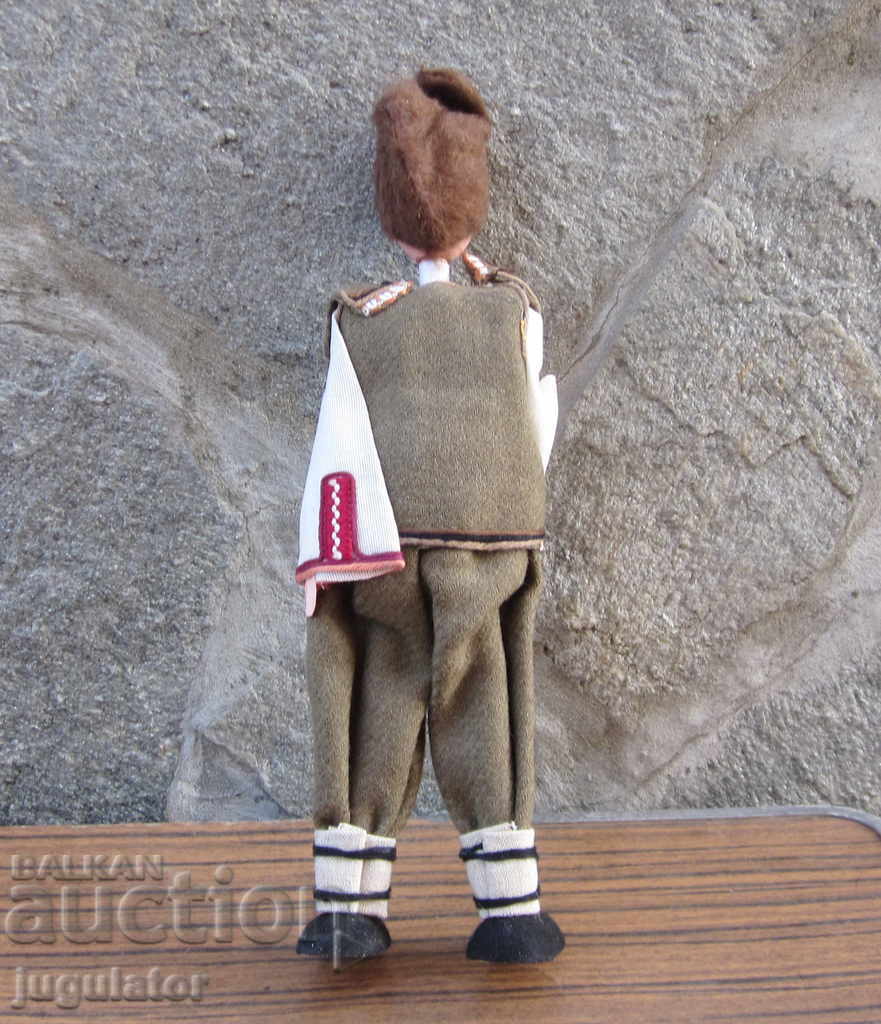 Delivery of Bulgarian folk doll statuette man in national costume