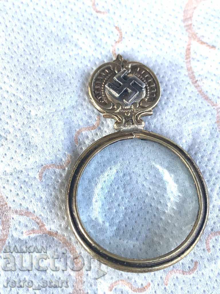Old magnifying glass, swastika