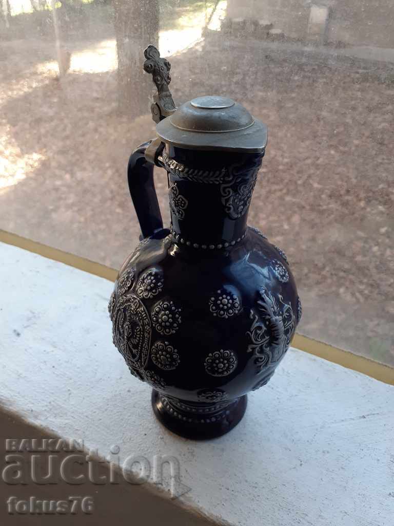 Auction Old German collector's wine jug with ceramic lid Auction Old German collector's wine jug with ceramic lid