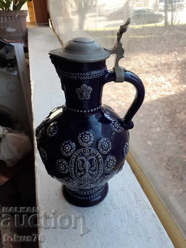 Old German collector's wine jug with ceramic lid