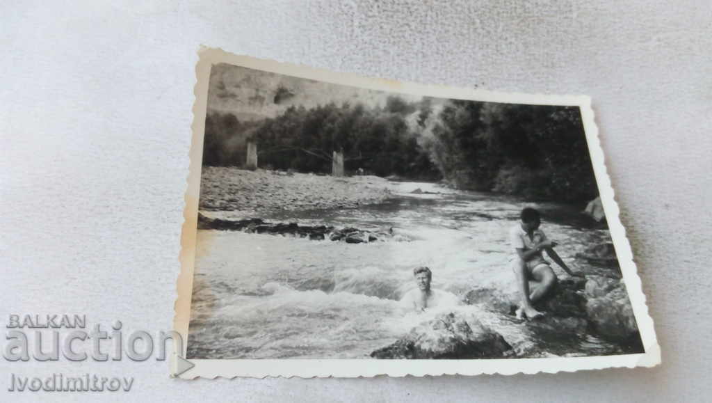 Photo Two men on the river