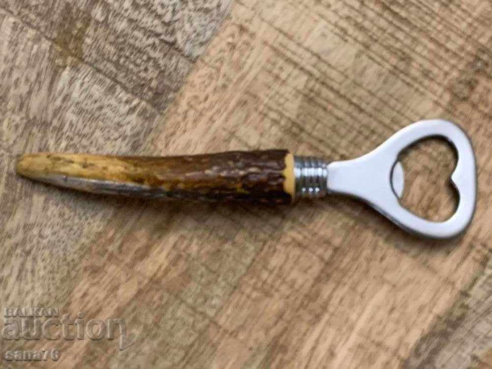 Delivery of Old, retro, vintage opener with horn handle Delivery of Old, retro, vintage opener with horn handle