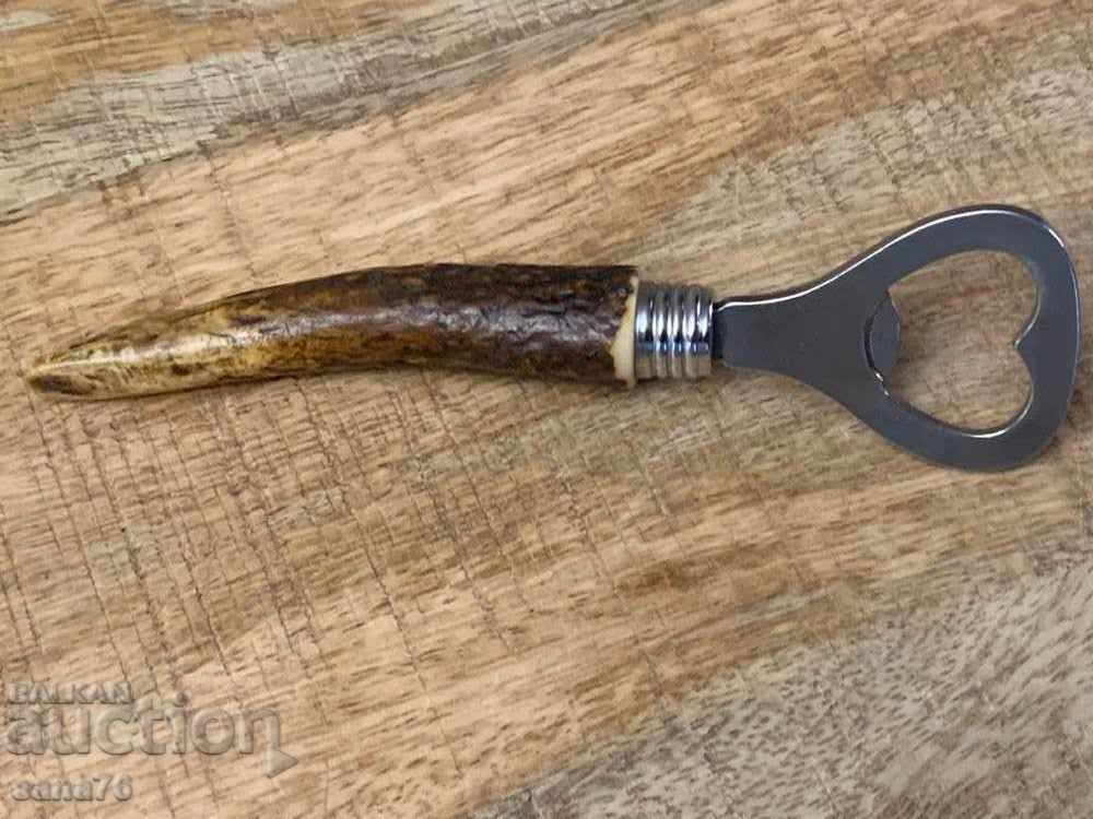 Old, retro, vintage opener with horn handle