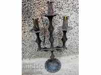 An old forged candlestick from a period period candle