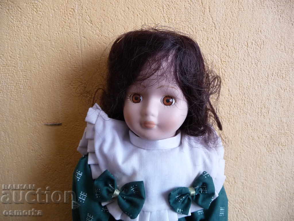 Porcelain doll with green dress and ribbons cool with price 23.00 BGN | € 11.76 Porcelain doll with green dress and ribbons cool with price 23.00 BGN | € 11.76