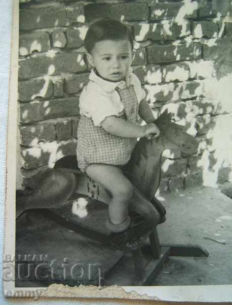 Little old photo of a child on a wooden horse swing with price 1.50 BGN | € 0.77 Little old photo of a child on a wooden horse swing with price 1.50 BGN | € 0.77