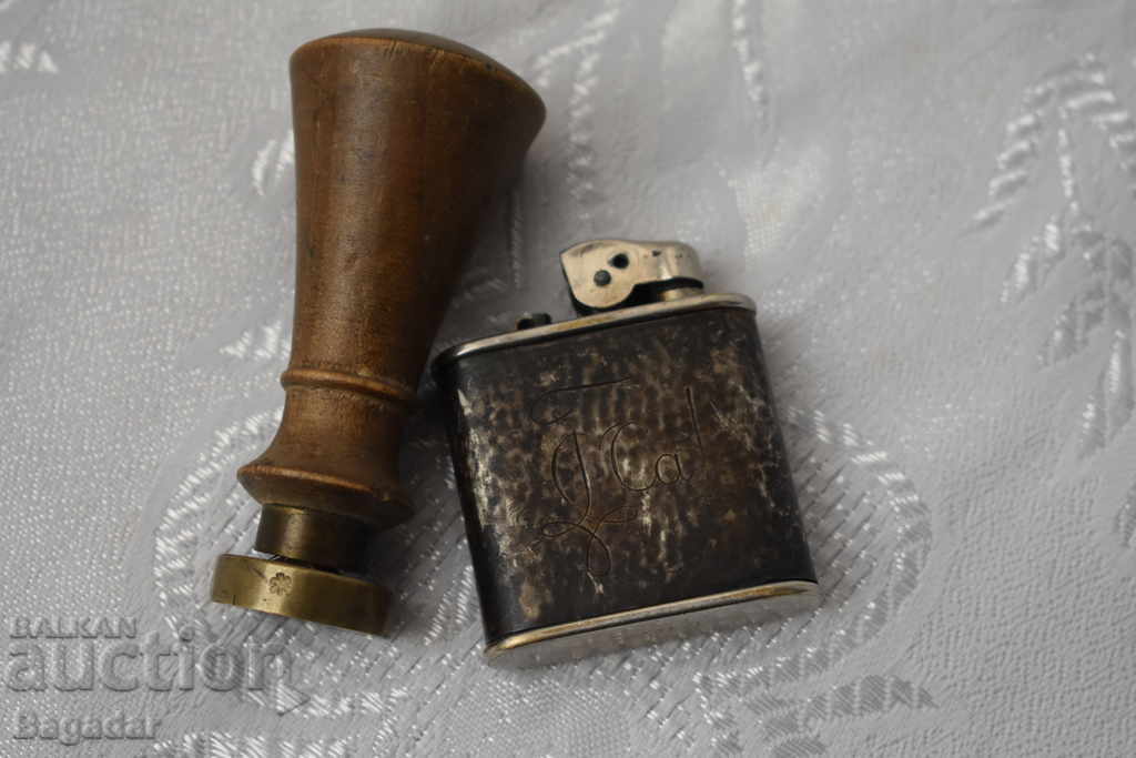 Silver lighter and bronze seal