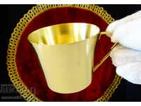 Brass cup.