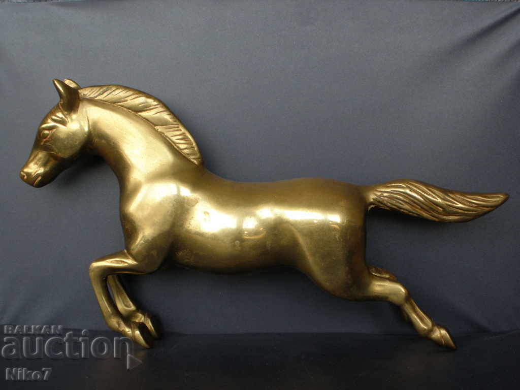 Massive brass horse from a fireplace clock. Massive brass horse from a fireplace clock.