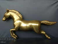 Massive brass horse from a fireplace clock.