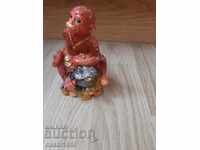 monkey figurine with frog