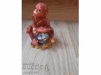 monkey figurine with frog