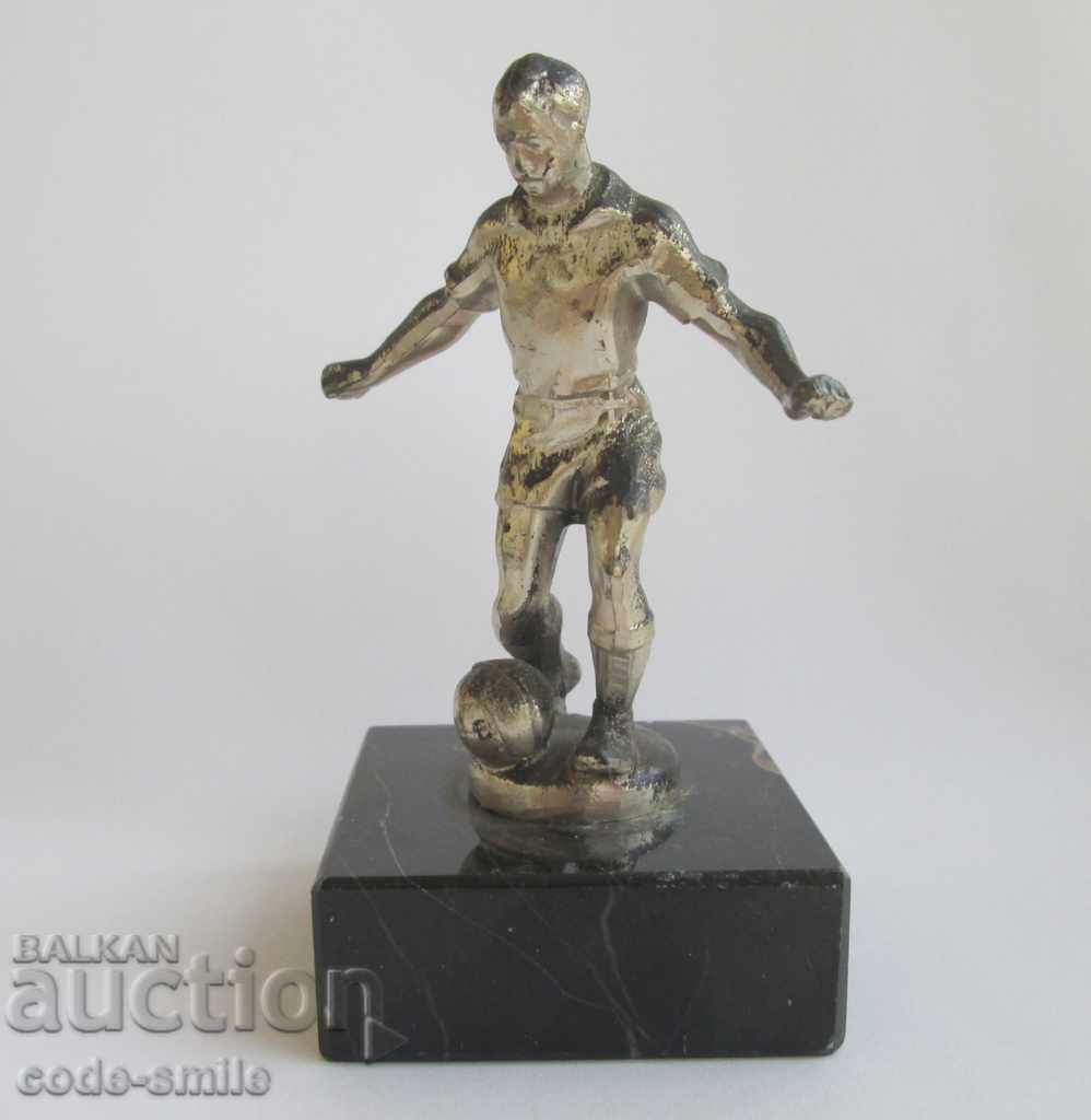 Old football figure statuette football player