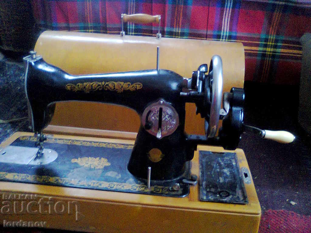 An old sewing machine. - 5 An old sewing machine. - 5