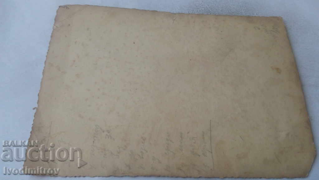 Photo Men and women on a wooden bench in front of a house with price 2.35 BGN | € 1.20 Photo Men and women on a wooden bench in front of a house with price 2.35 BGN | € 1.20